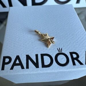 Tiny gold and black star Pandora ME charm
